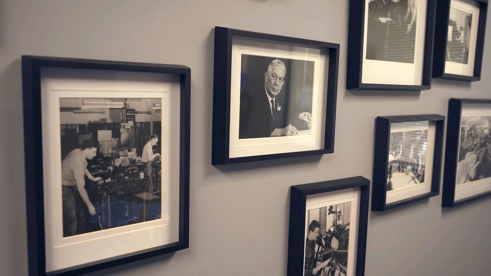 The archive photographs on the plant’s wall, the opening of the company film